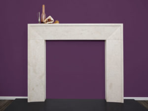 Contemporary minimalistic fireplace made of beige limestone