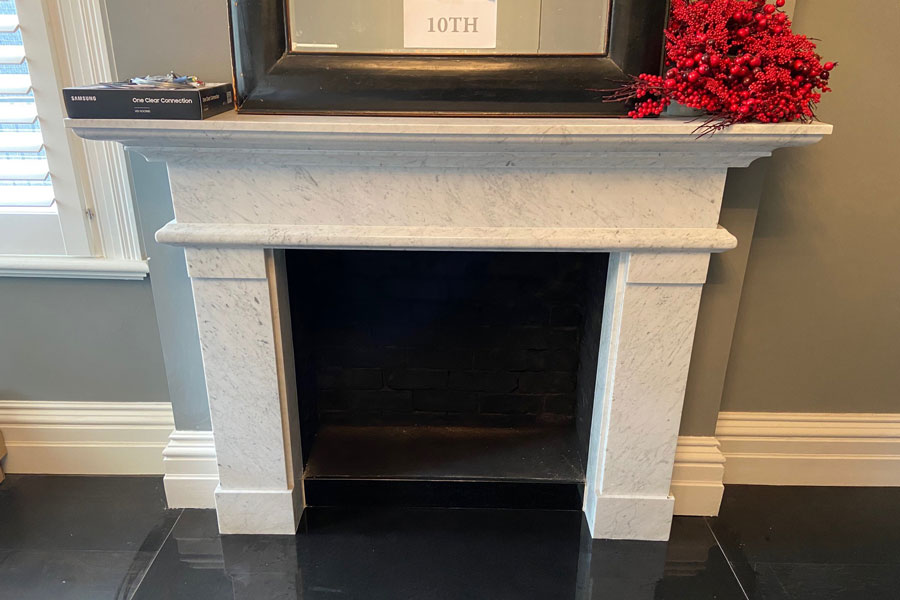 white Carrara marble fireplace