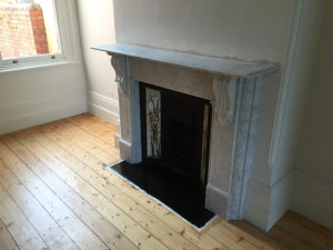 Victorian fully restored antique lintel fireplace with corbels and drops made of Italian White Carrara with a granite hearth