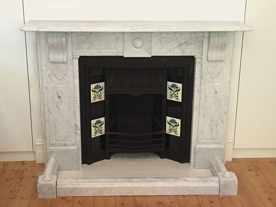 Victorian fully restored antique lintel fireplace with corbels and drops made of Italian White Carrara with a fender