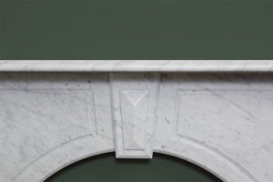 Victorian style arched fireplace made of Italian white Carrara marble