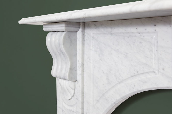 Victorian style arched fireplace made of Italian white Carrara marble
