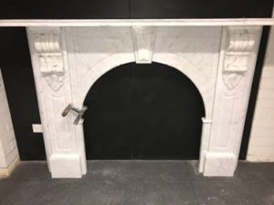 Victorian style antique arched fireplace made of Italian white Carrara