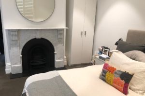 Victorian style arched fireplace made of Italian white Carrara