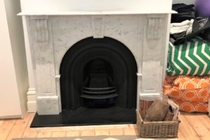 Victorian style arched fireplace made of Italian white Carrara